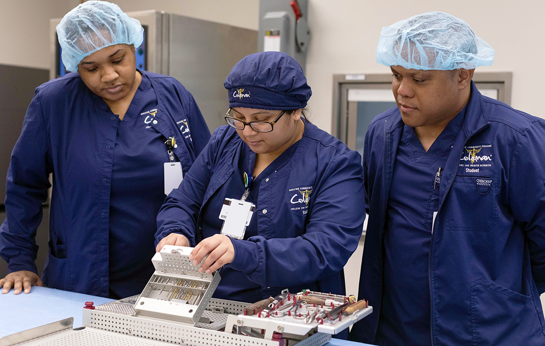 Sterile Processing students inspect sterilization equipment